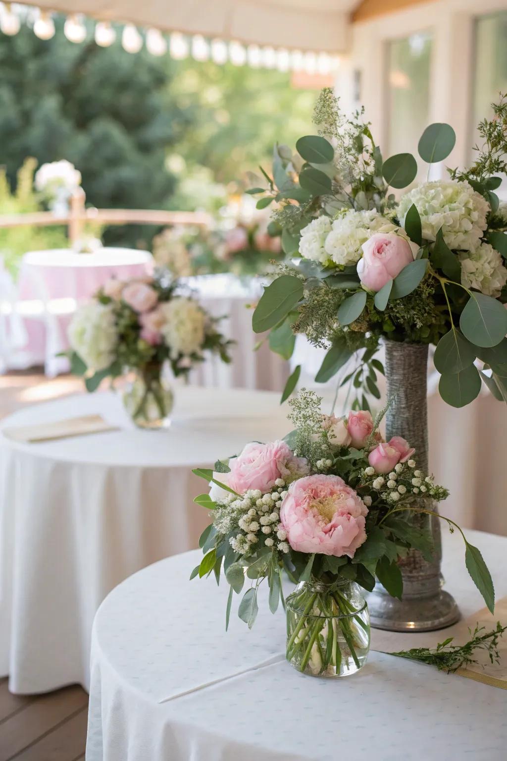 Elegant floral arrangements with peonies and eucalyptus bring nature indoors beautifully.