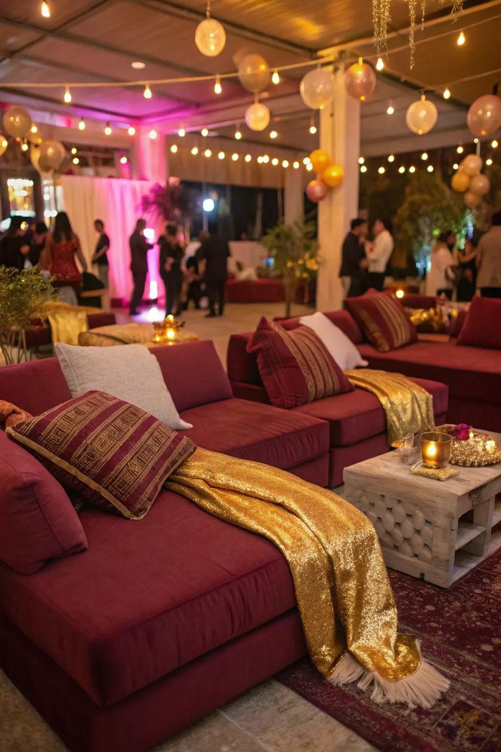 Cozy lounge areas with burgundy and gold accents invite guests to relax.