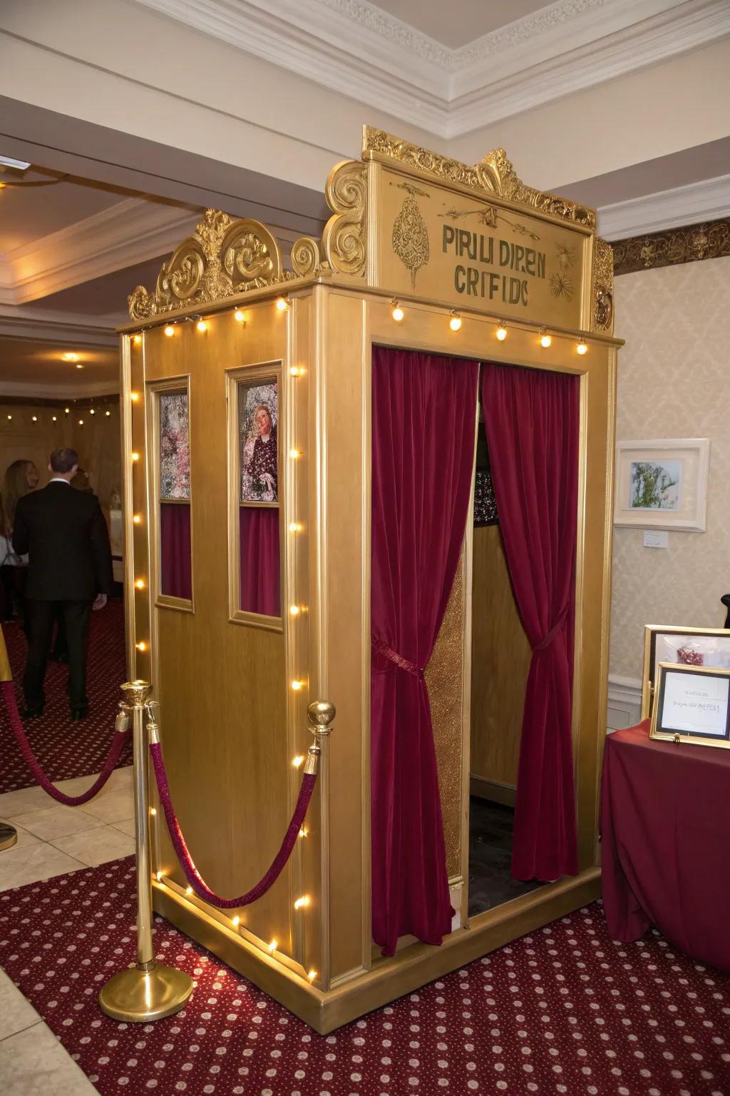 A golden photo booth with burgundy accents offers fun photo opportunities.