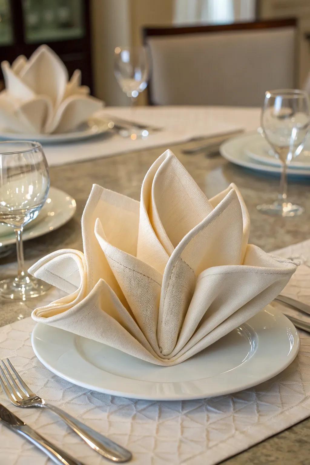 The courtyard bloom napkin fold, simple beauty at its best.