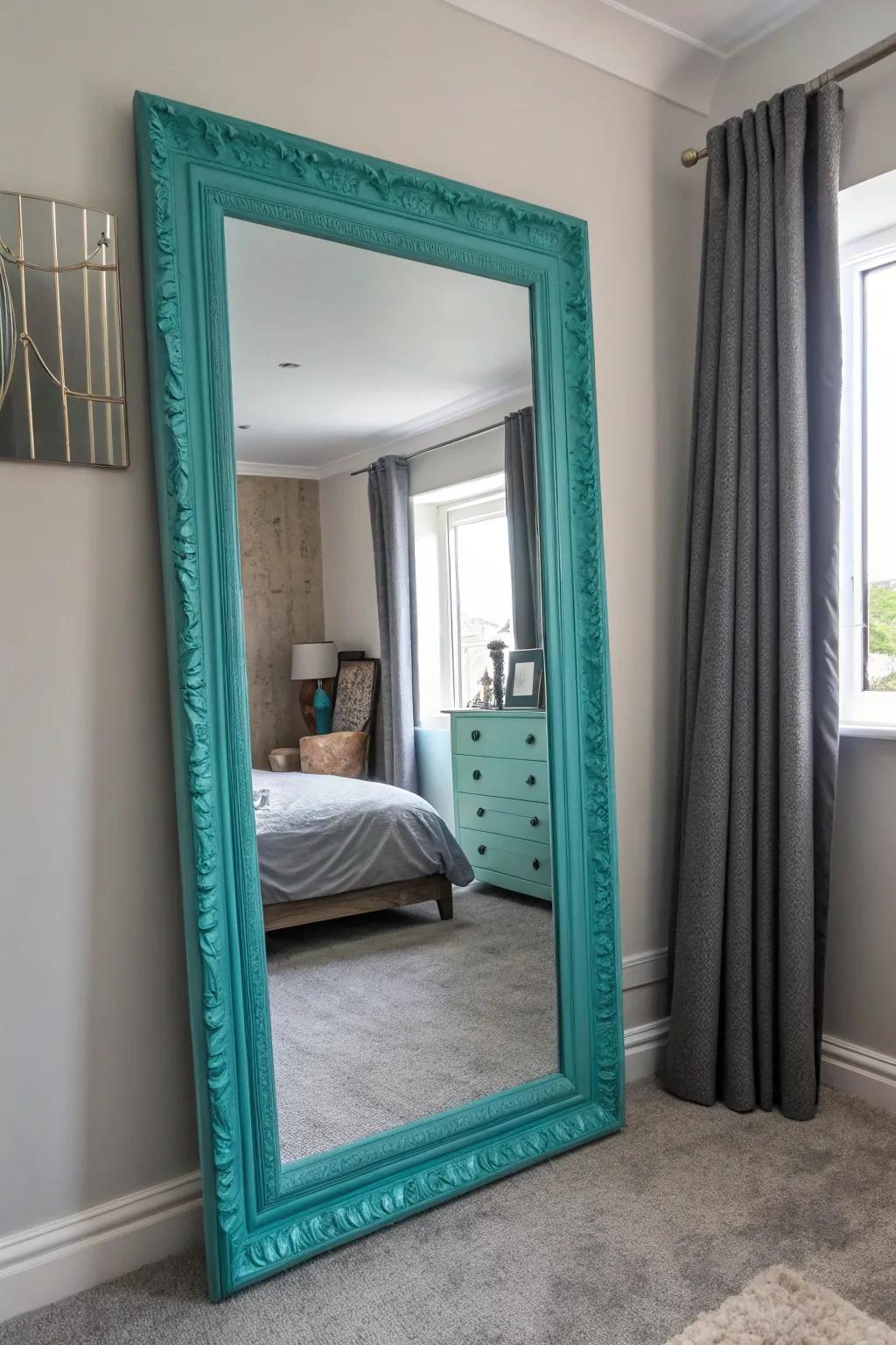 A turquoise-framed mirror adds style and amplifies the space.