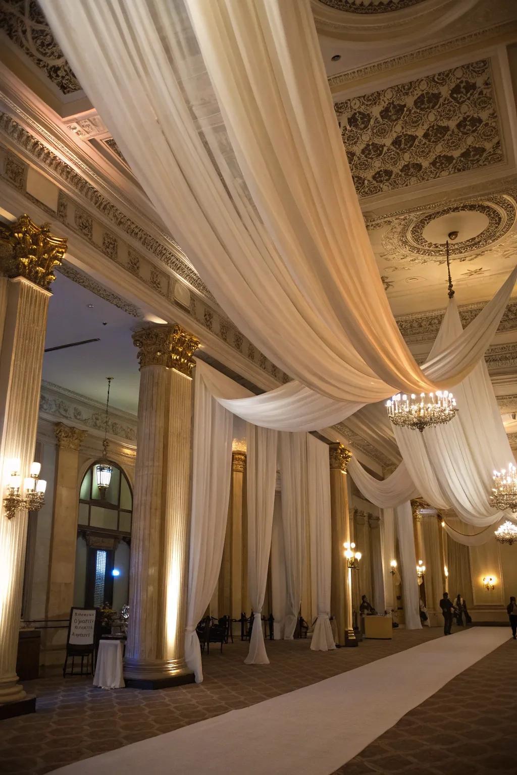 Refined ceiling drapery introduces an element of luxury to the birthday venue.