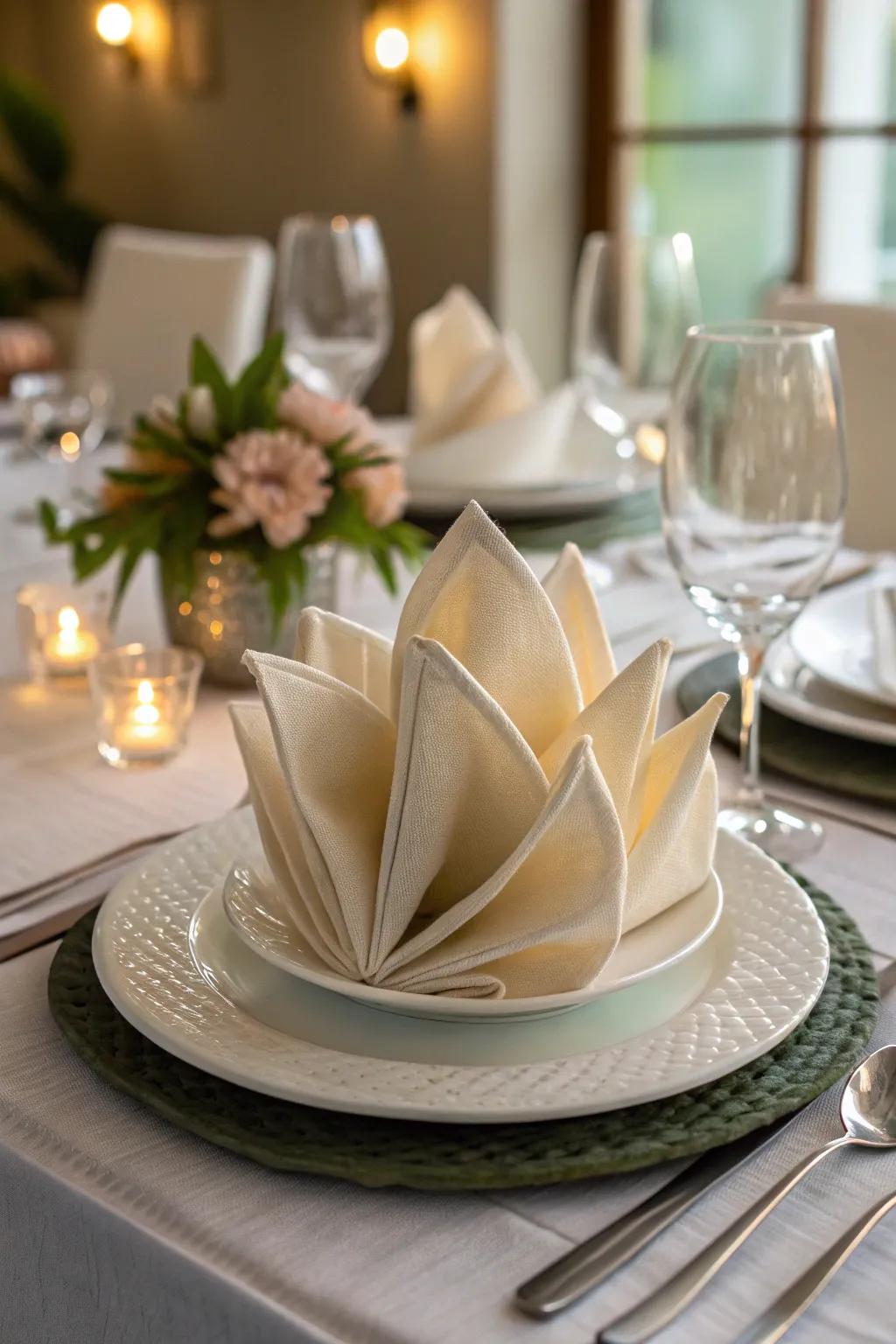 The blossom of the lotus napkin fold brings an exotic feel to your decor.