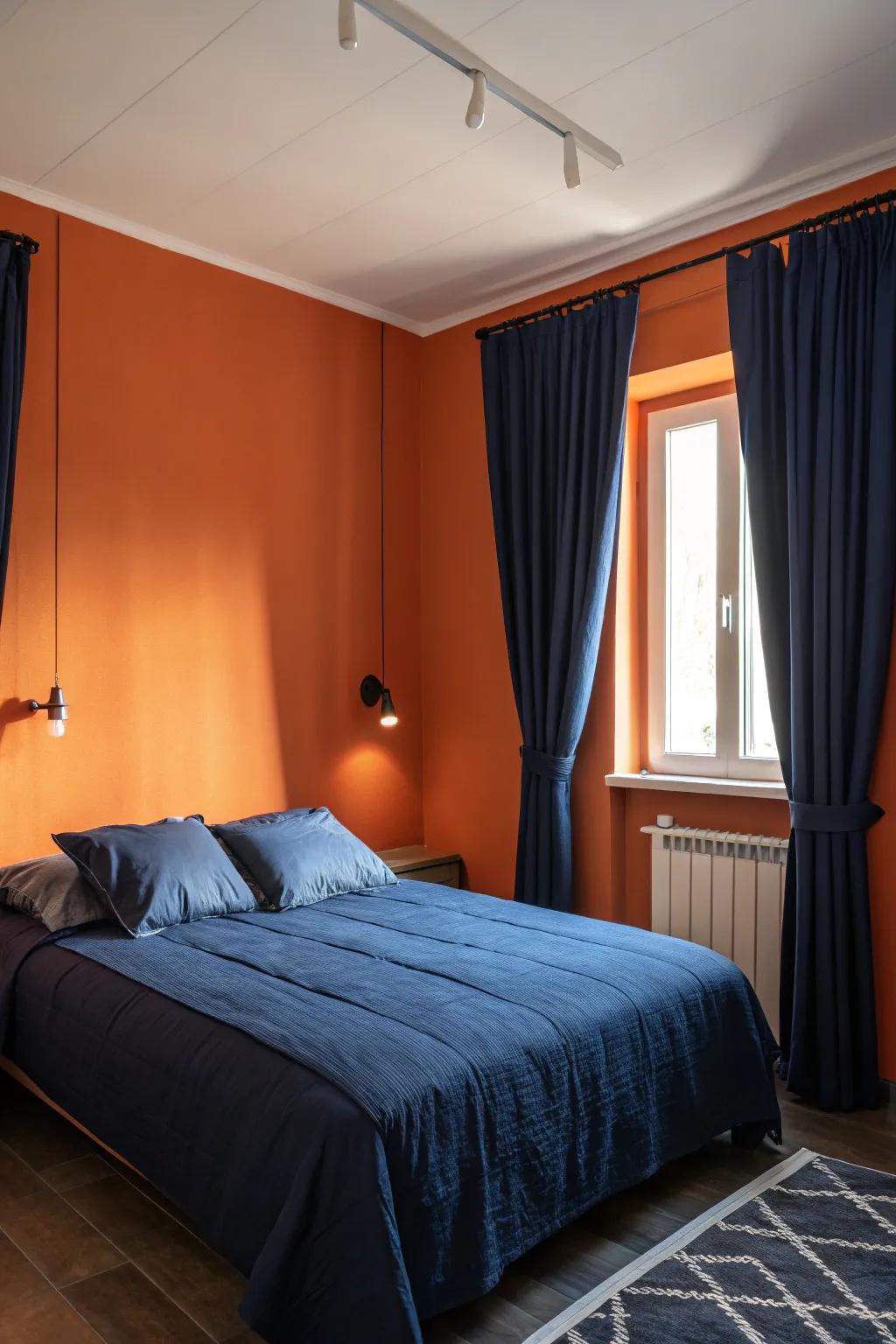 Navy accents provide a calming contrast to bold orange walls.