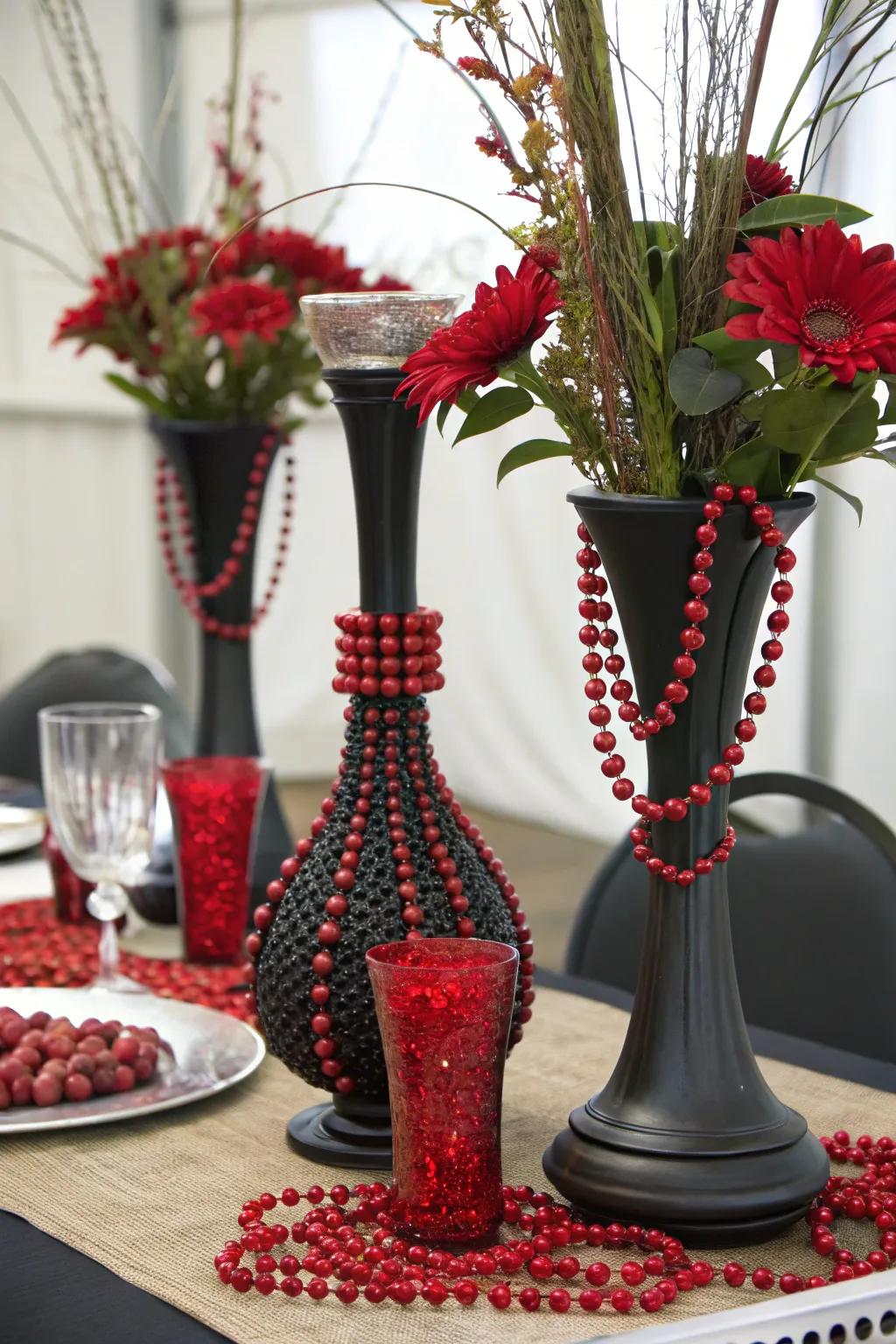 A mix of materials including black ceramic and red beads for a textured centerpiece.