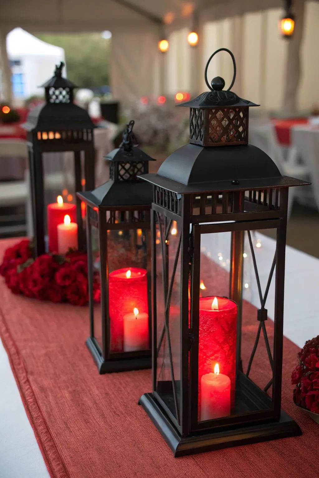 Black lanterns with red candles create a warm and inviting centerpiece.