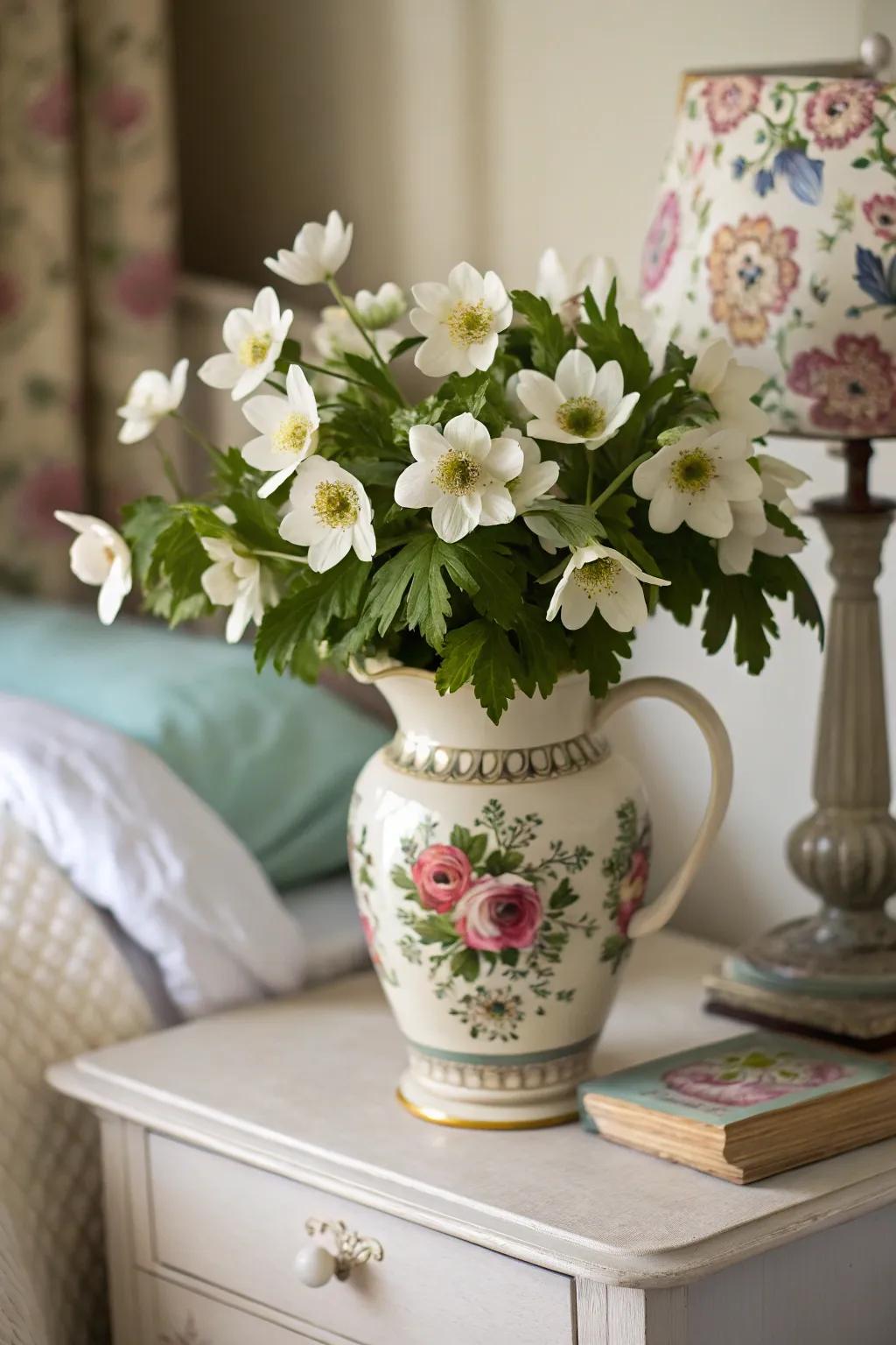 Charming anemone arrangement infusing a bedchamber with caprice.