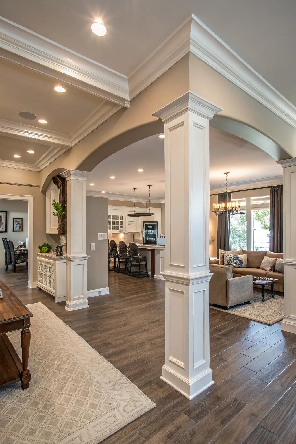 An open-concept living area with large crown molding, adding a sense of grandeur and unity.