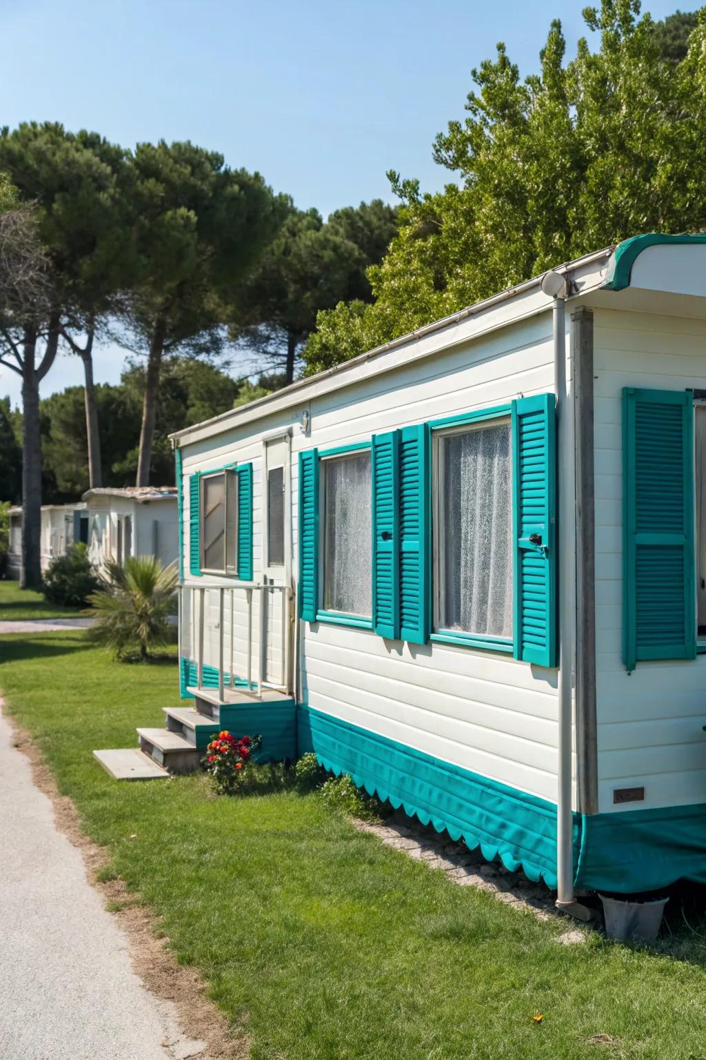 Teal shutters adding a splash of color to a mobile home.