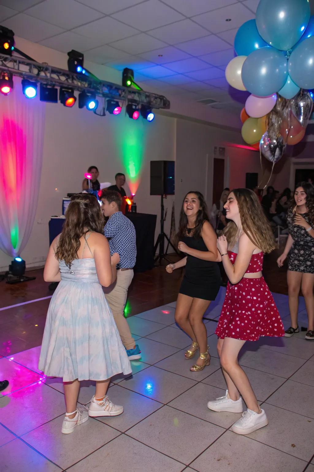 A lively dance floor at a sweet sixteen party.