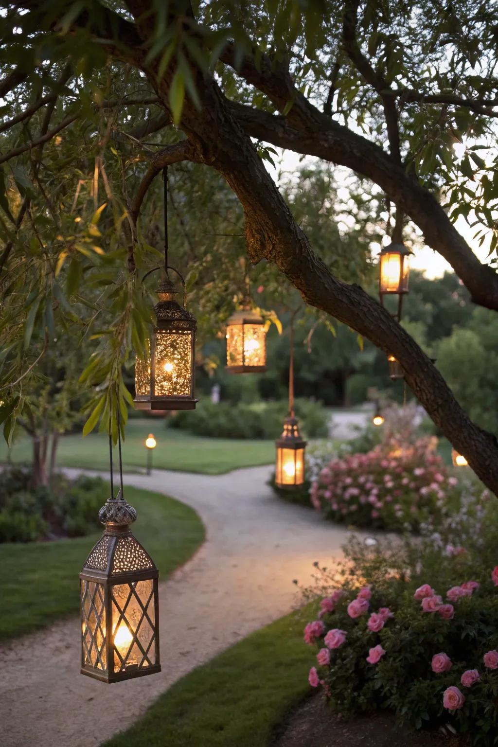 Tree lanterns with fairy lights create a magical garden feel.