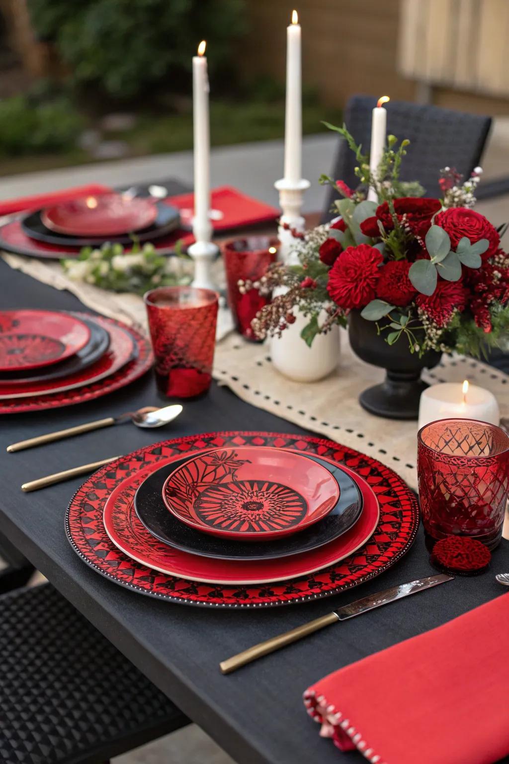 Red and black themed tableware perfectly complementing the centerpiece.