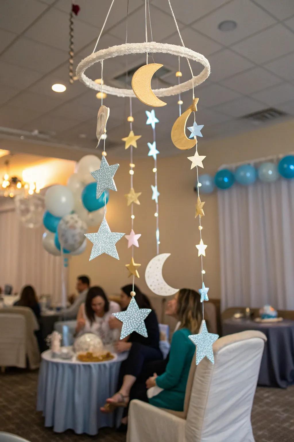 A creative mobile with stars and moons adds a magical touch to the baby shower decor.