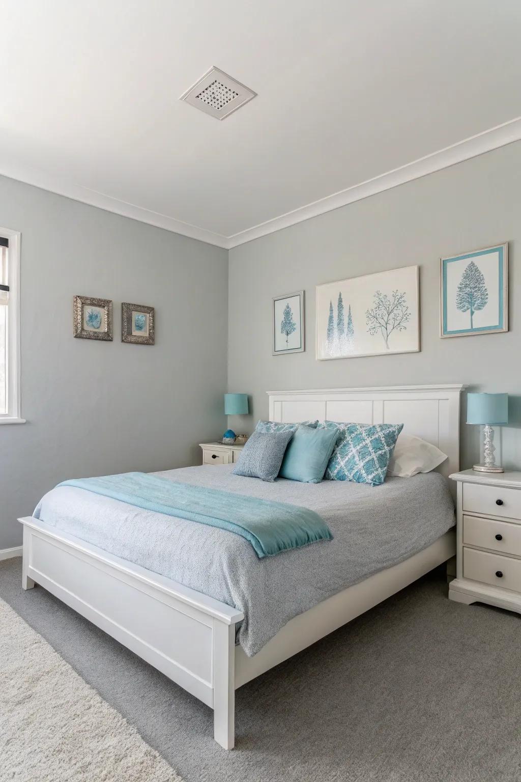 A minimalist style with grey walls and blue accents creates a serene bedroom.